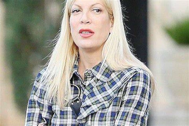 EXCLUSIVE Tori Spelling's REVENGE romance! Star pictured passionately