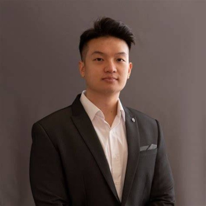 Wayne Liang lying inside a car